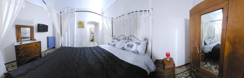 Una cama o camas en una habitación de Casa di Nonna Nì