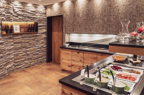 a kitchen with a sink and a counter top at Widmann's Löwen in Königsbronn