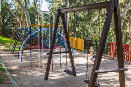 a group of playground equipment in a park at AluaSun Costa Park in Torremolinos