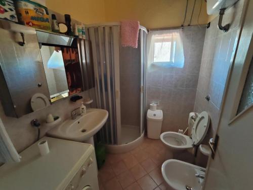 a bathroom with a sink and a toilet and a shower at Casa in centro - Mormanno in Mormanno
