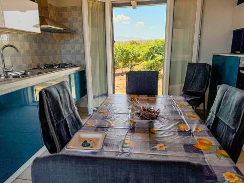 a kitchen with a table with a plate on it at Annarosa in Sorso