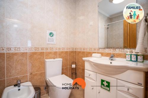 a bathroom with a toilet and a sink and a mirror at #201 Families Only - Quinta da Flor in Vale de Pedras