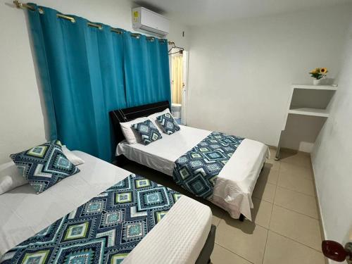 Postel nebo postele na pokoji v ubytování Apartamentos Manatwar