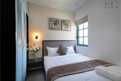 Ένα ή περισσότερα κρεβάτια σε δωμάτιο στο Novaworld Phan Thiết - Ni Villa