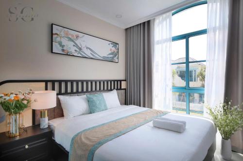 Ένα ή περισσότερα κρεβάτια σε δωμάτιο στο Novaworld Phan Thiết - Ni Villa