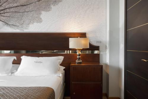 Postel nebo postele na pokoji v ubytování Hotel St.Mauritius