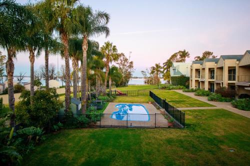 an aerial view of a yard with a swimming pool at Elsinor Townhouse 1 in Mulwala