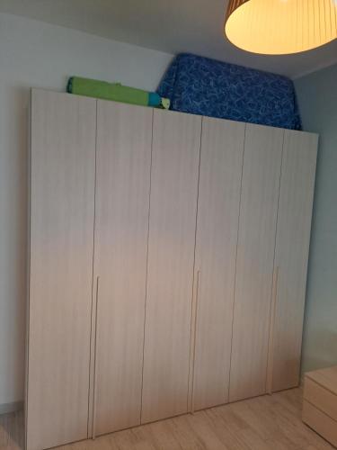 a bedroom with a bed on top of cabinets at Trilocale San Vincenzo in San Vincenzo
