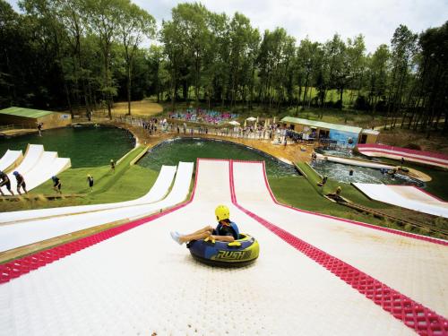 a person riding on a ride at a roller coaster at Holiday Home in Avrillé near Sandy Beaches in Saint-Hilaire-la-Forêt