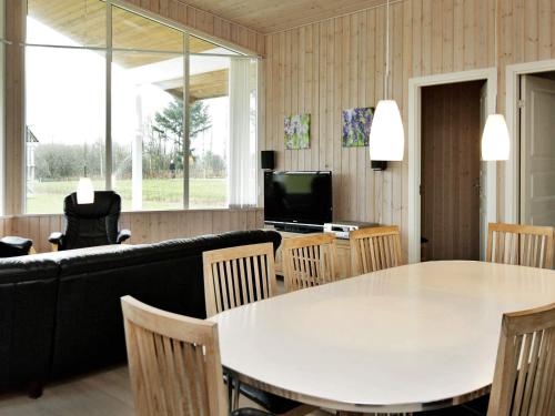 a living room with a white table and a couch at 10 person holiday home in Ansager-By Traum in Ansager