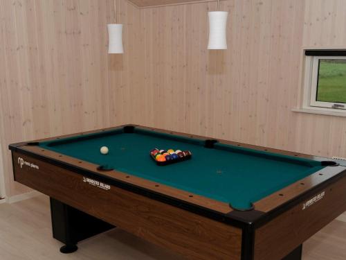 a pool table with a ball in a room at 10 person holiday home in Ansager-By Traum in Ansager