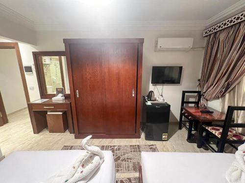 El Aida Pyramids View Boutiqueにあるテレビまたはエンターテインメントセンター