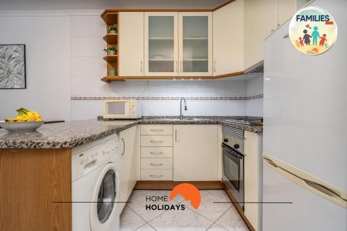 a kitchen with a sink and a dishwasher at #230 Only Families - Flat A Flor by Home Holidays in Albufeira