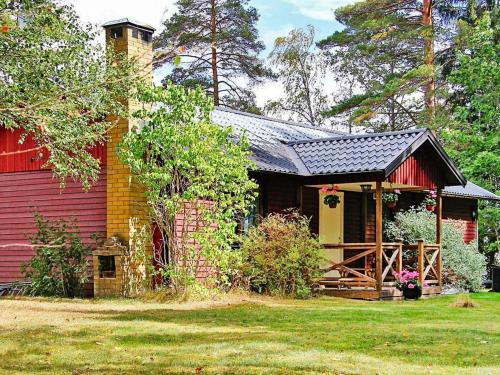 a house with a red and yellow house at 6 person holiday home in Vena-By Traum in Vena