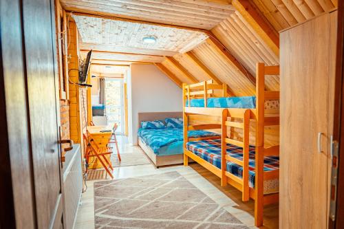 a bedroom with bunk beds in a house at STD Stara Vodenica in Crni Vrh