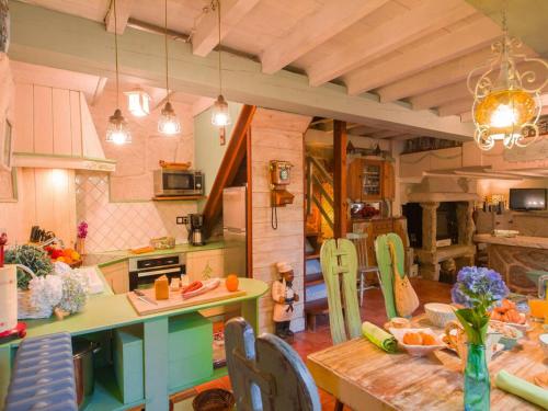 a kitchen with a table and a dining room at Villa in A Lama near Rías Baixas Beaches in A Lama