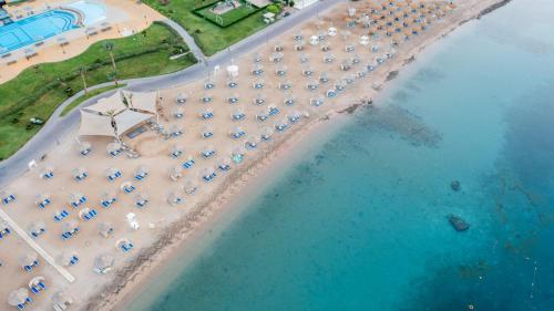 an aerial view of a beach with umbrellas and the water at Old Palace Resort Sahl Hasheesh in Hurghada