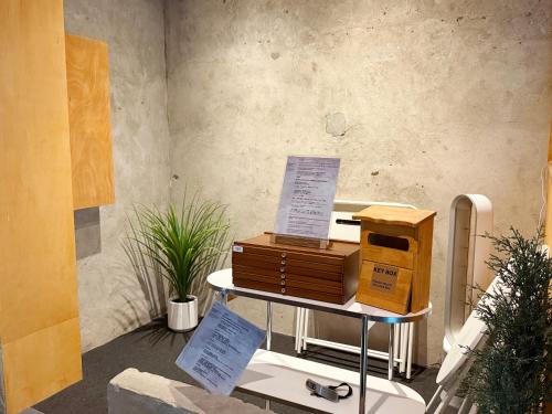 a table with a box on top of it at 누크인 nook Inn in Seoul