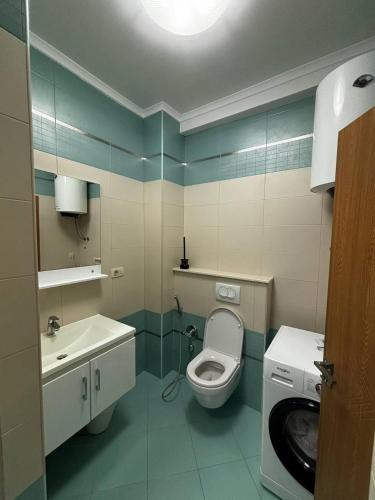 a bathroom with a toilet and a sink at Villa Smokovac in Risan