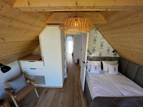 a bedroom with a bed in a attic at Yama Krywe in Krywe