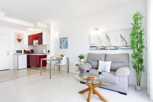 a living room with a couch and a table at Sasemar Paradise in Adeje