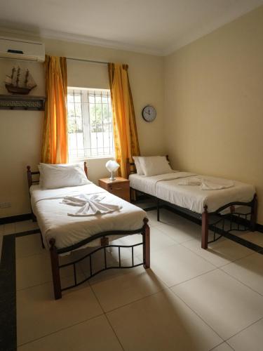 Кровать или кровати в номере Hidden Haven at Mariam Villa