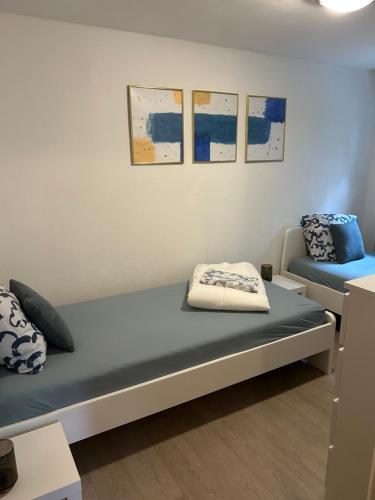 a room with a bed and a couch at Haus Annemiek in Winterberg