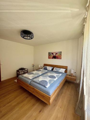 a bedroom with a large bed in a room at Landglück in Tettnang
