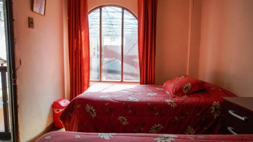 a small bedroom with a bed and a window at Bed, Breakfast And Adventure Club - BBAC at Carlos V in Potosí