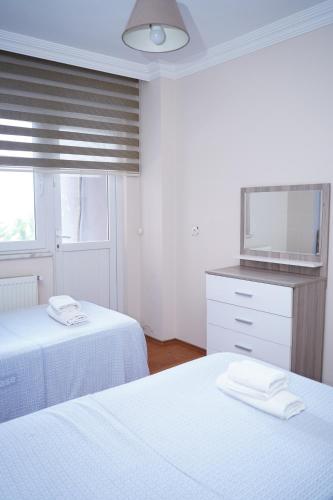 Ένα ή περισσότερα κρεβάτια σε δωμάτιο στο HAS HOME NOZBARt