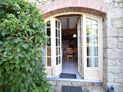 an entrance to a house with an arch doorway at Holiday Home in Saizy with Stargazing Garden in Vignol