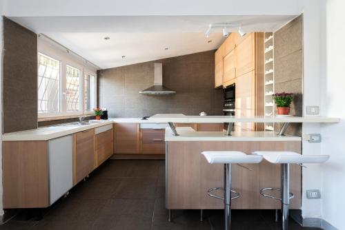 Η κουζίνα ή μικρή κουζίνα στο Ostia Beach Apt - 1 Minute Walk