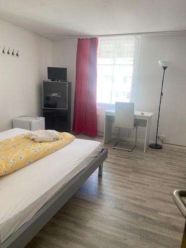 Un ou plusieurs lits dans un hébergement de l'établissement Gasthof Sternen Thörishaus bei Bern