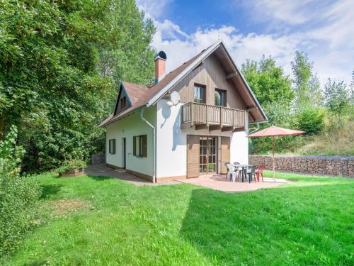 a house with a patio and a yard at Holiday Home in Javorník near Krkonose Park in Rudník