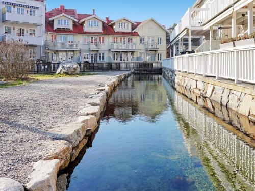 a river in a city with buildings and houses at 7 person holiday home in STRöMSTAD in Strömstad