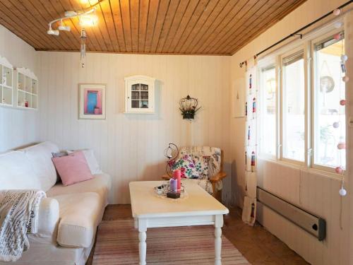 a living room with a couch and a table at 5 person holiday home in Uddevalla in Uddevalla