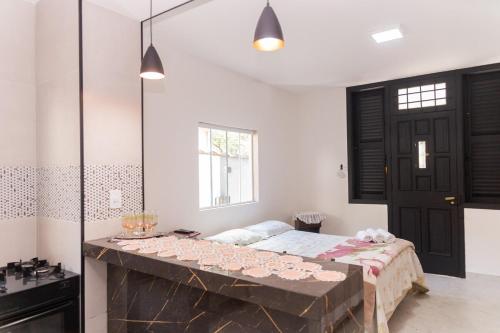 a bedroom with a large bed and a large mirror at Casa no centro histórico ,passeio sem carro rock the mountain 2026 in Petrópolis
