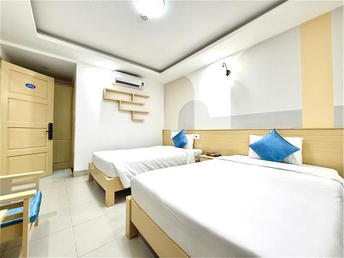 Ένα ή περισσότερα κρεβάτια σε δωμάτιο στο Sea Charm Da Nang