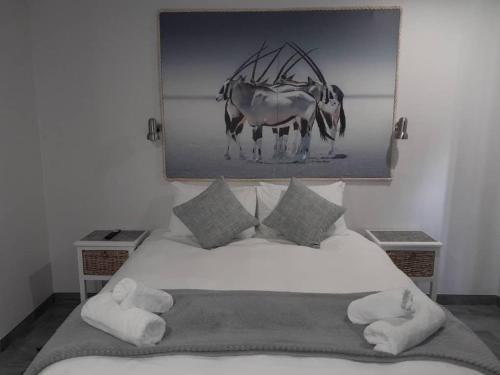 Ένα ή περισσότερα κρεβάτια σε δωμάτιο στο Oryx Guesthouse