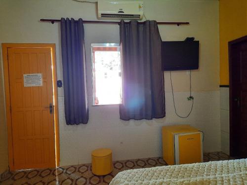Postel nebo postele na pokoji v ubytování Hospedagem Serra da Lua