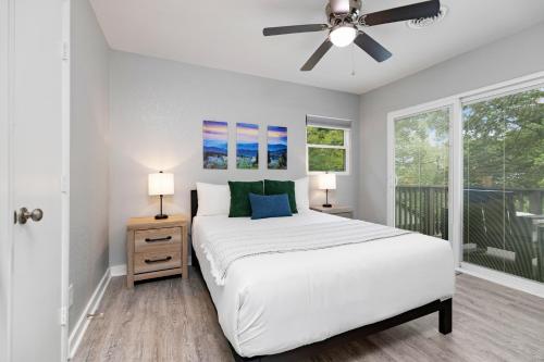 a bedroom with a bed and a ceiling fan at Gum Tree 5 with Wintergreen Advantage in Wintergreen