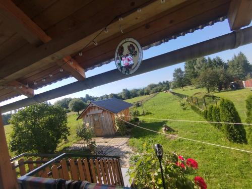a view of a garden from the balcony of a house at Retro apartament Lukas in Ostrowsko
