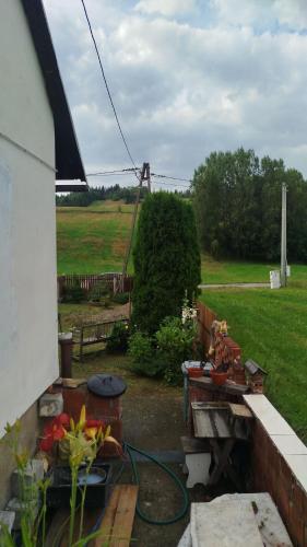 a view of a yard with a garden at Retro apartament Lukas in Ostrowsko