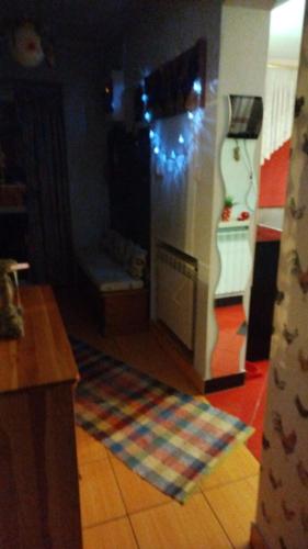 a living room with a refrigerator with christmas lights at Retro apartament Lukas in Ostrowsko