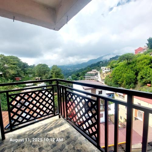 a view from the balcony of a house at Charming 2BR Apartment with Balcony and Mountain View - Logan's Transient Apartment 2 in Baguio
