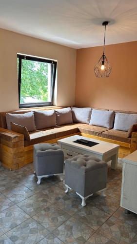 a living room with a couch and a table at Sofkin salas in Prijedor