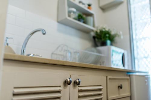 a kitchen with a sink and a counter top at Ein Zivan Village Resort in Ein Zivan