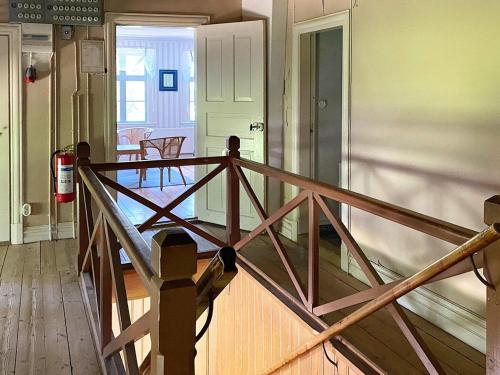 a wooden porch with a wooden railing in a room at 7 person holiday home in SANDHEM-By Traum in Sandhem