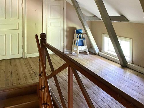 a room with a wooden floor and a ladder at 7 person holiday home in SANDHEM-By Traum in Sandhem