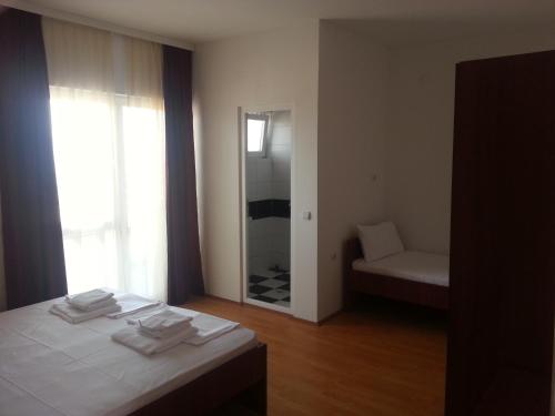Postel nebo postele na pokoji v ubytování Apartmani Marija